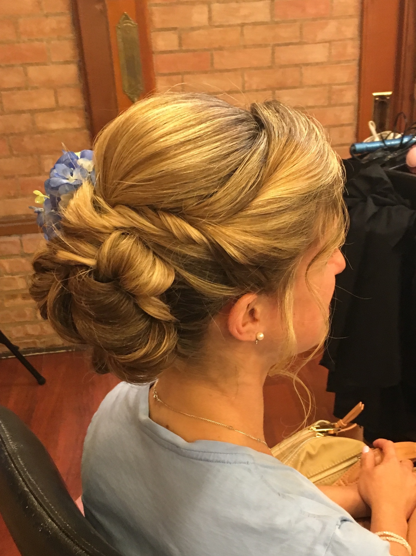 Twisted updo with floral accent