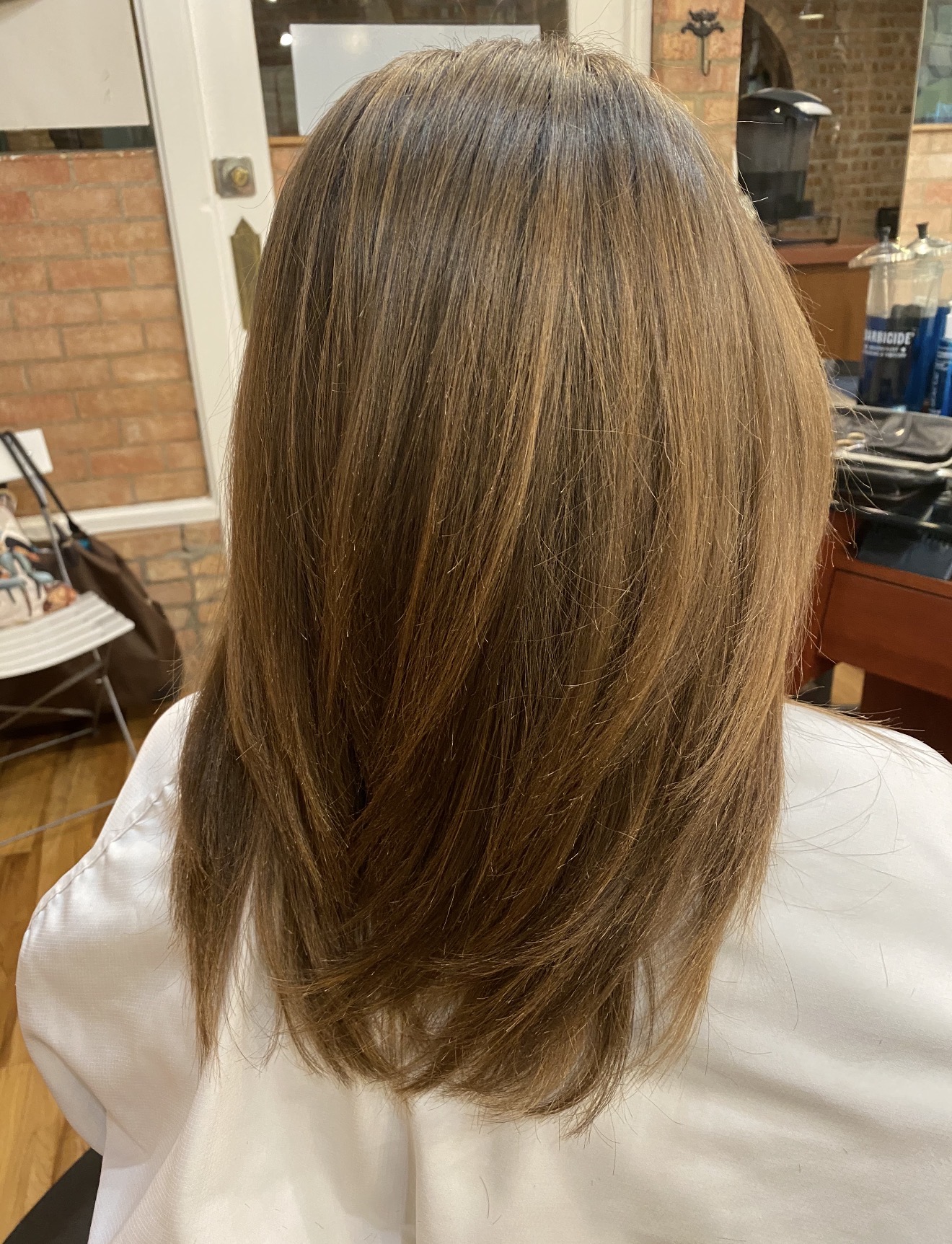 Sleek brunette blowout with subtle layers